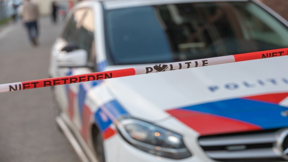 Politieauto afzetlint